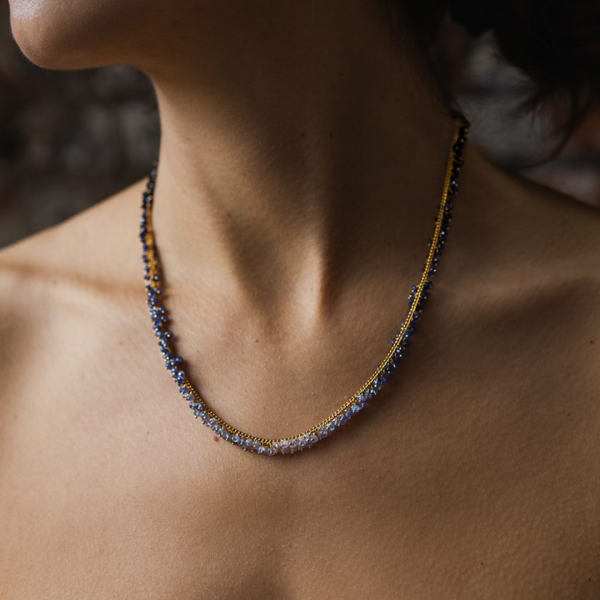 Model wearing a sapphire necklace