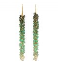 Photo of emerald earrings, with ombre effect, on gold china. White background.