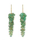 Photo of green emerald earrings with gold chain on white background
