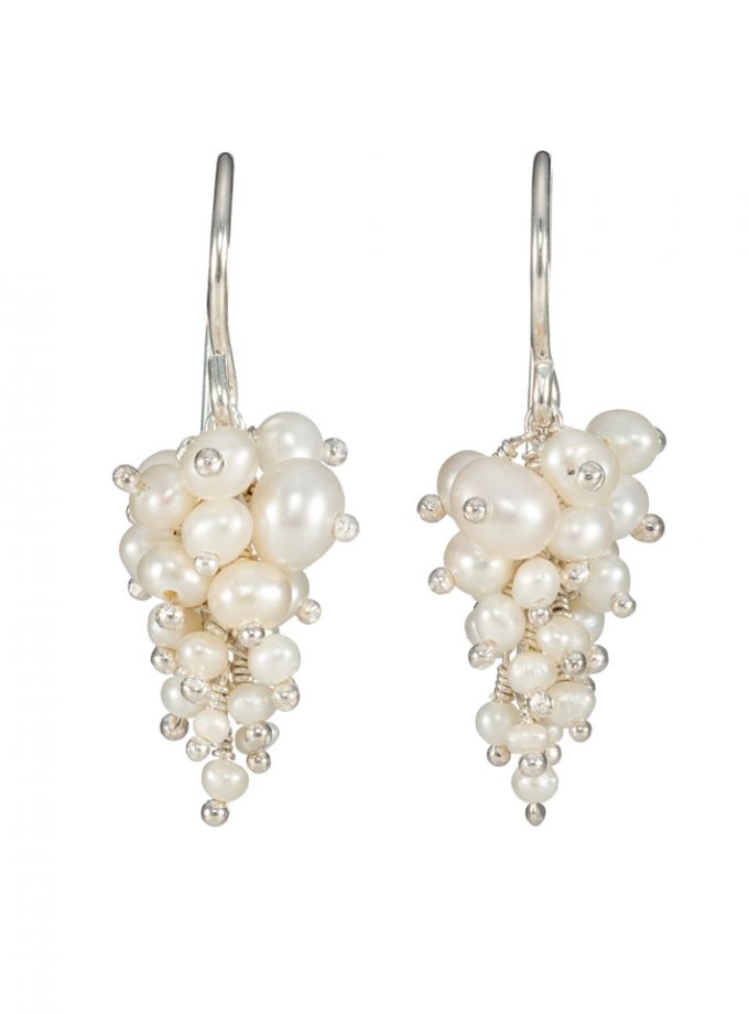 A pair of pearl and silver cluster earrings
