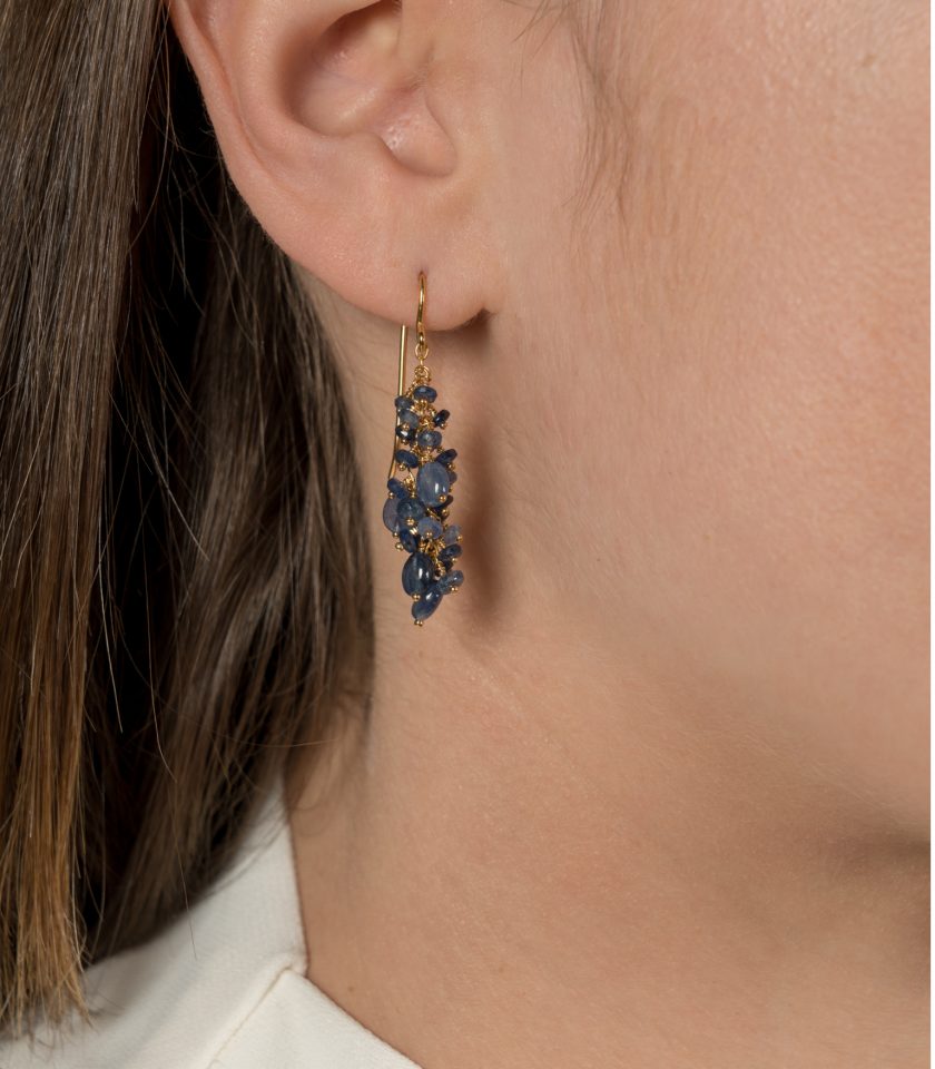 Blue sapphire bead earrings on a model