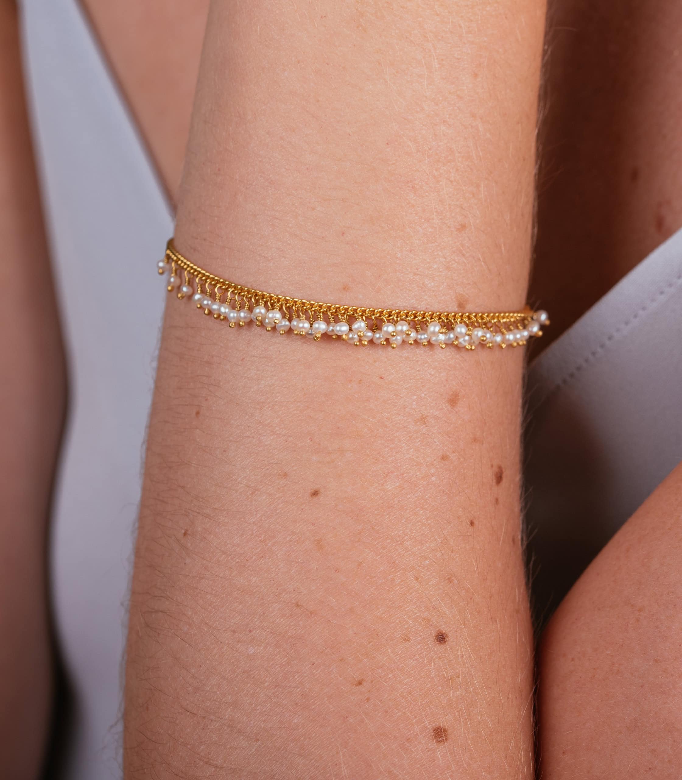 Pearl bracelet on a model's arm